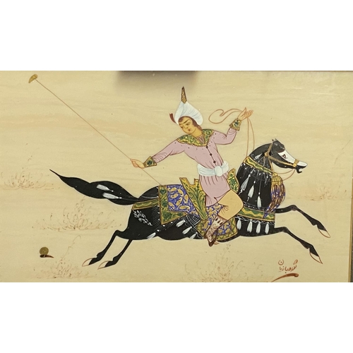 57 - Pair of Iranian figures on horses in decorative clothing, playing a form of polo, in deep fabric gil... 