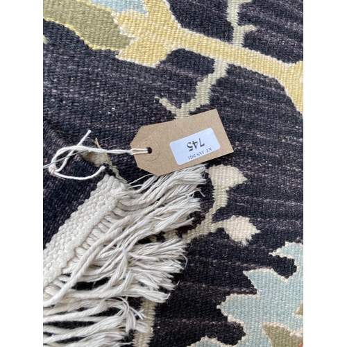 745 - Modern kelim style rug, with black ground and multi pattern, 262 x 140 cm (condition is good)