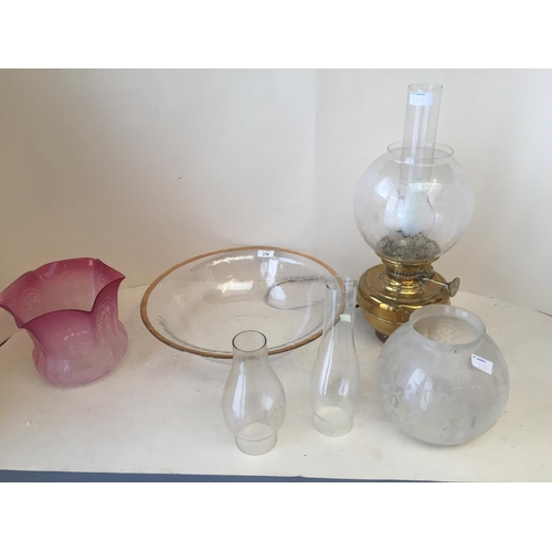 278 - Gold coloured rimmed glass open bowl 38cm D, a brass oil lamp with etched glass and funnel, 2 other ... 