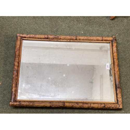 413 - Three wall mirrors, including a bevelled oval wall mirror in worn wooden  frame, and 2 rectangular m... 