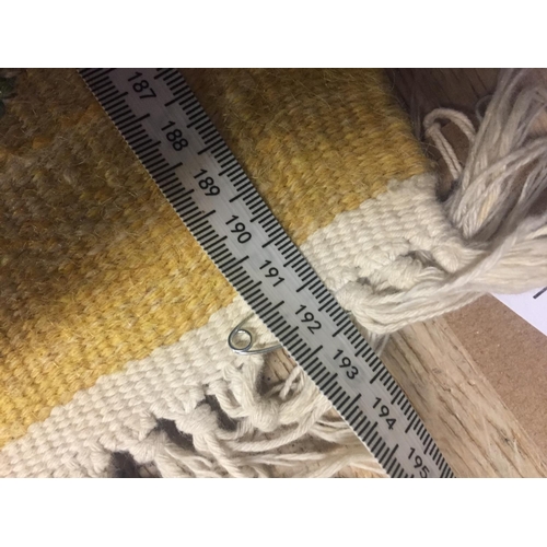 748 - Modern yellow ground rug, with floral patterns  123 cm x 193 cm.  Condition fairly good.   stain on ... 