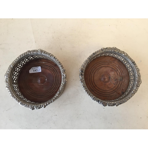 182 - Pair old plated wine bottle coasters with turned mahogany bases 14 cm internal D 1 base loose from b... 