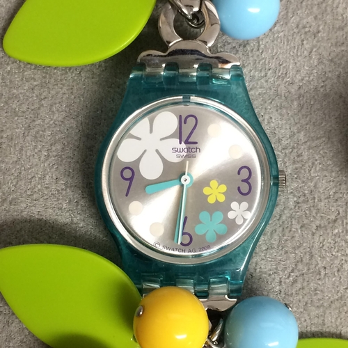 411 - SWATCH 1990s  with floral white metal band and a white metal finger watch