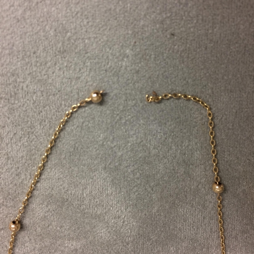 413 - 9 ct gold ball and chain necklace, 2.1 grams