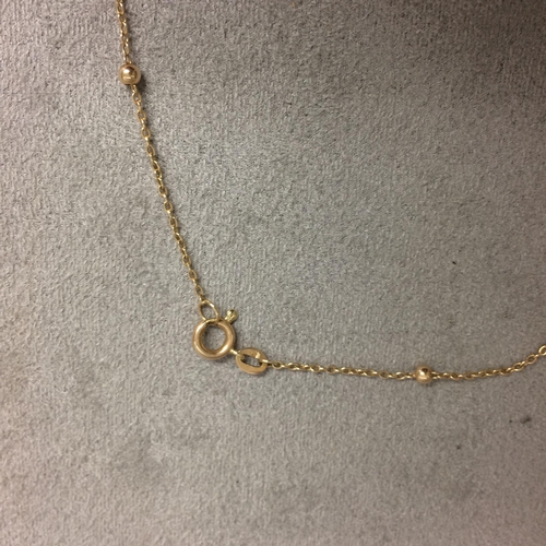 413 - 9 ct gold ball and chain necklace, 2.1 grams