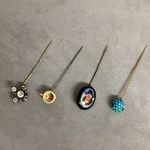 103 - Collection of four hat pins, one with cabochon turquoise finial