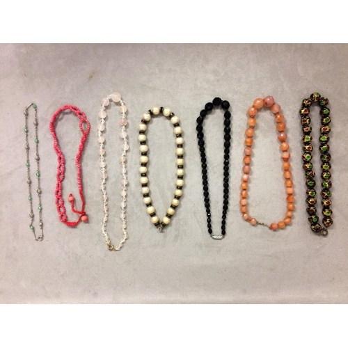 106 - Collection of beaded jewellery to include a carnelian carved strand