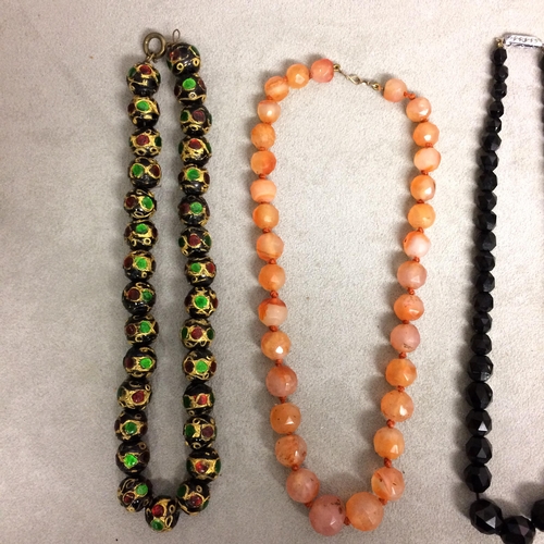 106 - Collection of beaded jewellery to include a carnelian carved strand