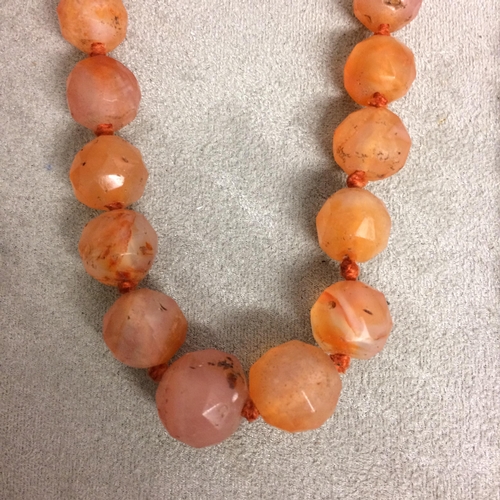 106 - Collection of beaded jewellery to include a carnelian carved strand