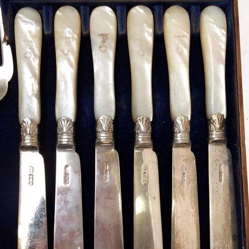 108 - A good cased set of Sterling silver fish knives and forks and servers, with mother of pearl handles,... 