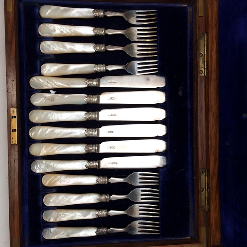 108 - A good cased set of Sterling silver fish knives and forks and servers, with mother of pearl handles,... 