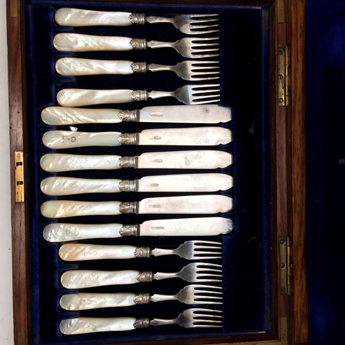 108 - A good cased set of Sterling silver fish knives and forks and servers, with mother of pearl handles,... 