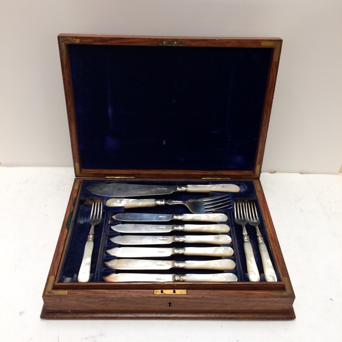 108 - A good cased set of Sterling silver fish knives and forks and servers, with mother of pearl handles,... 