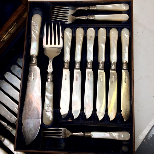 108 - A good cased set of Sterling silver fish knives and forks and servers, with mother of pearl handles,... 