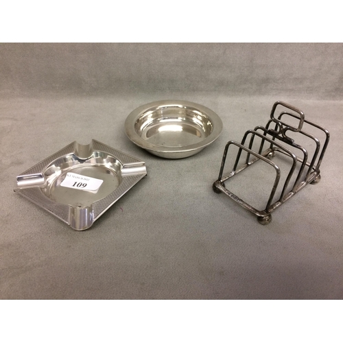 109 - Two sterling silver ashtrays together with a sterling silver toast rack, various dates and makers, 6... 