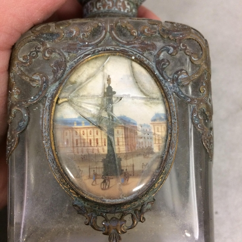 115 - A gilt metal mounted scent bottle, with four hand painted panels of the sights of London, with gilde... 