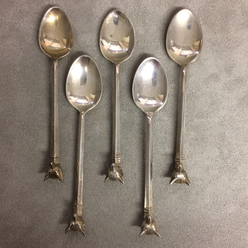 118 - A collection of sterling silver and unmarked white metal items to include an Irish silver spoon, fox... 