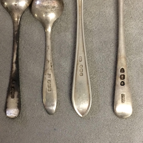 118 - A collection of sterling silver and unmarked white metal items to include an Irish silver spoon, fox... 