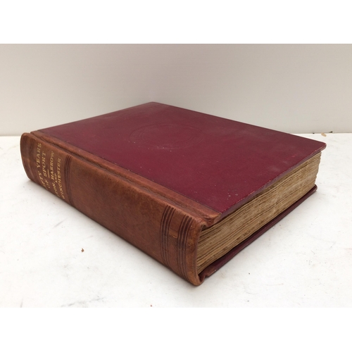 129 - Large red leather bound book, 