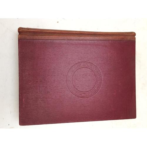 129 - Large red leather bound book, 