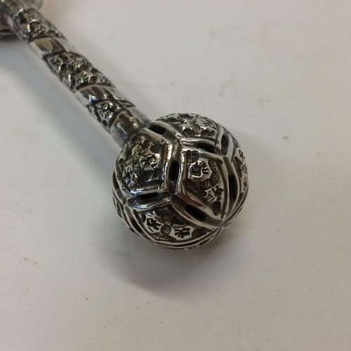 13 - Indian white metal baby rattle with pierced decoration