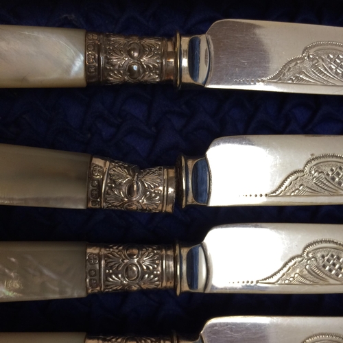 142 - A fitted cased ,six person set, of decorative engraved mother of pearl and white metal knife and for... 