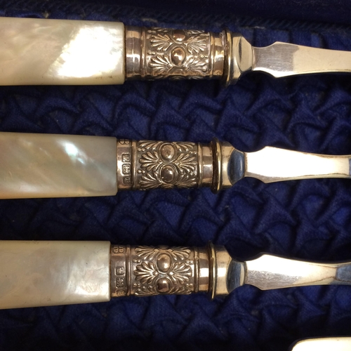 142 - A fitted cased ,six person set, of decorative engraved mother of pearl and white metal knife and for... 