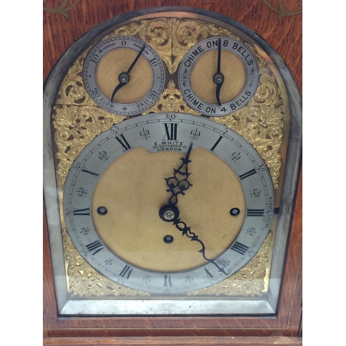 143 - A large square framed oak and brass inlaid bracket clock, E White, 20 Cockspur Street, London,  bras... 