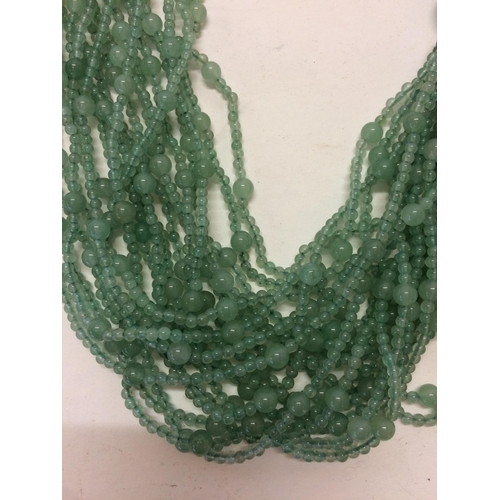 15 - Jade necklace, C20th, 3 strands of Jade (type 3) beaded multistrand necklace, in a Shanghai Tang fit... 