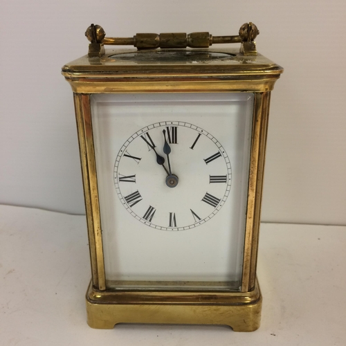 188 - French gilt brass carriage clock with 4 bevelled glass panes with key