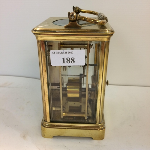 188 - French gilt brass carriage clock with 4 bevelled glass panes with key