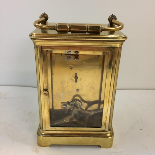 188 - French gilt brass carriage clock with 4 bevelled glass panes with key