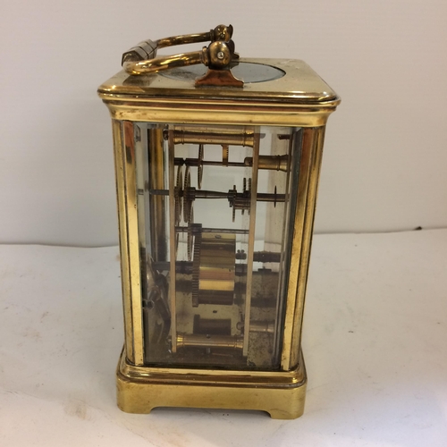 188 - French gilt brass carriage clock with 4 bevelled glass panes with key