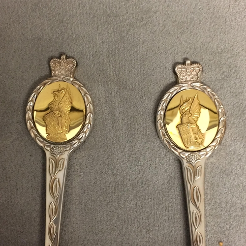 19 - A boxed st of 8 Sterling silver commemorative spoons, 