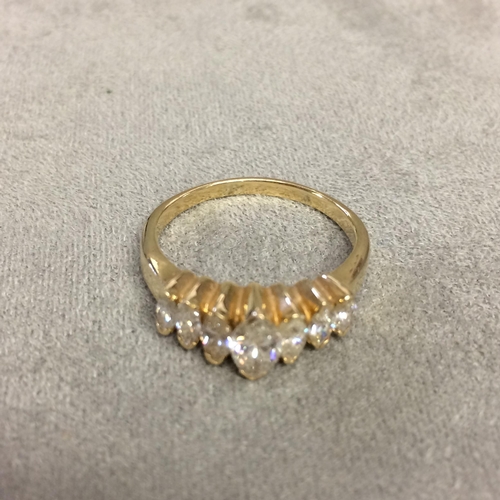 21 - 14k gold and diamond ring set with graduated line of marquis cut diamonds, 4.1g