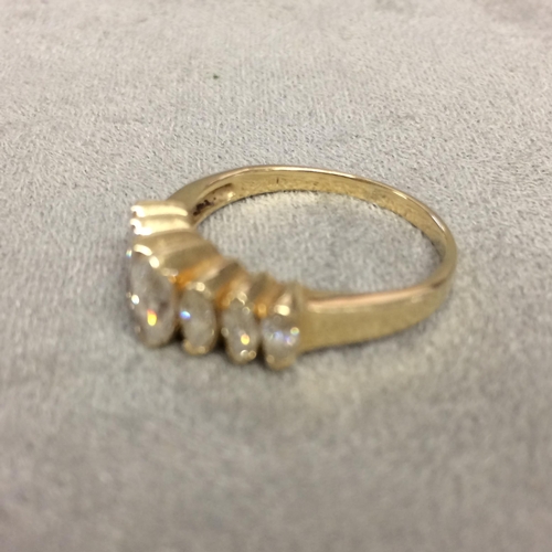 21 - 14k gold and diamond ring set with graduated line of marquis cut diamonds, 4.1g