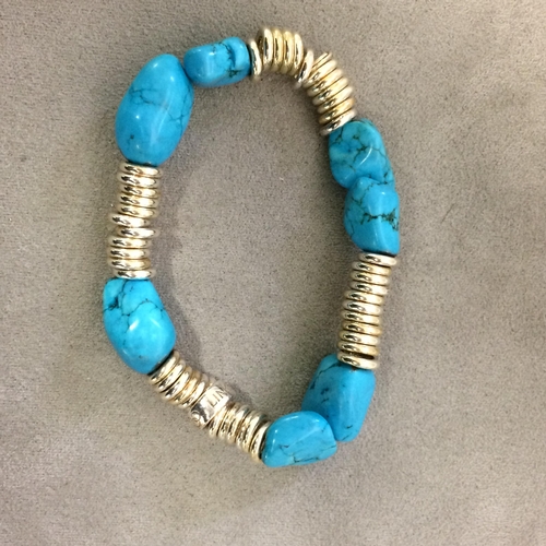 23 - Turquoise and white metal bracelet on elasticated strap