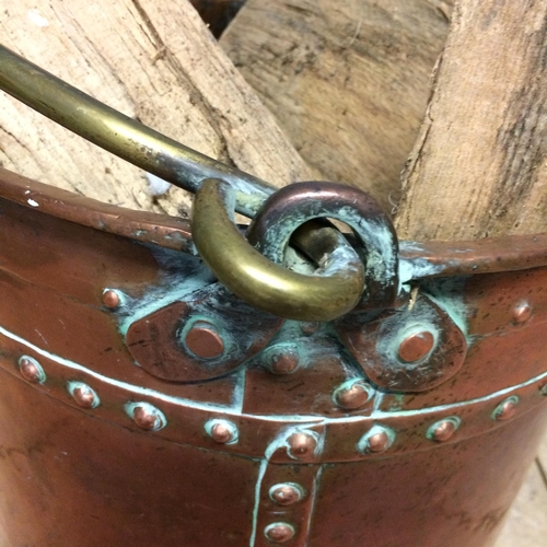 234 - Large brass bucket with handle (full of wood!)