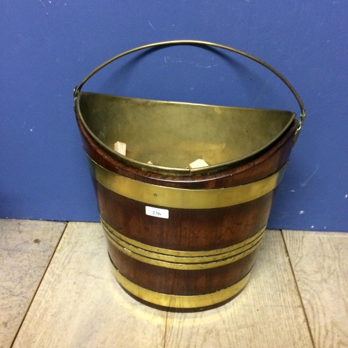 236 - Mahogany and brass bound peat bucket with handle, and with inset brass bucket