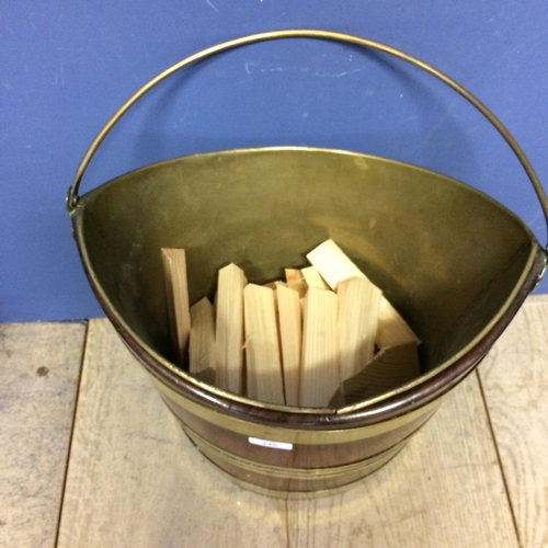 236 - Mahogany and brass bound peat bucket with handle, and with inset brass bucket