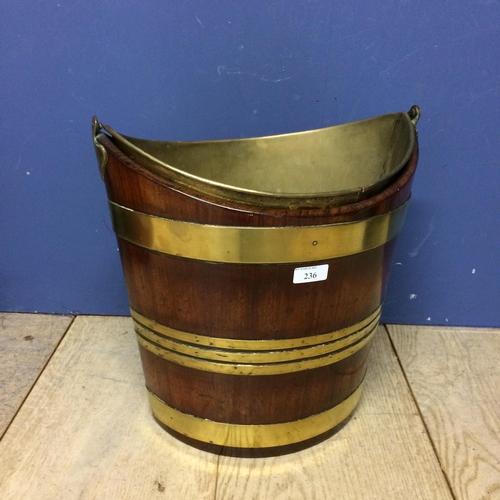 236 - Mahogany and brass bound peat bucket with handle, and with inset brass bucket