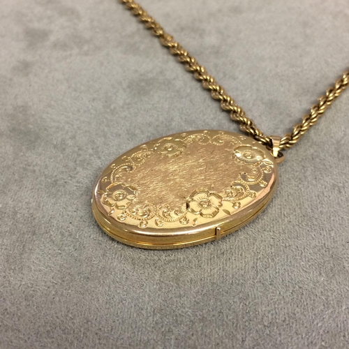 25 - 9 ct gold rope twist necklace with a 9ct gold oval picture locket with engraved decoration 12g