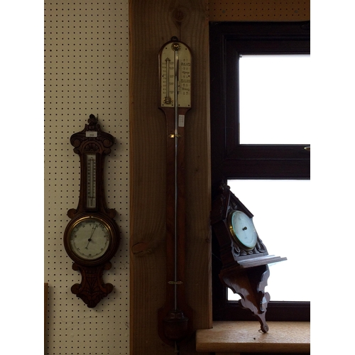 255 - 3 Barometers - a stick barometer, and an oak framed wall barometer, and an oak framed barometer on w... 