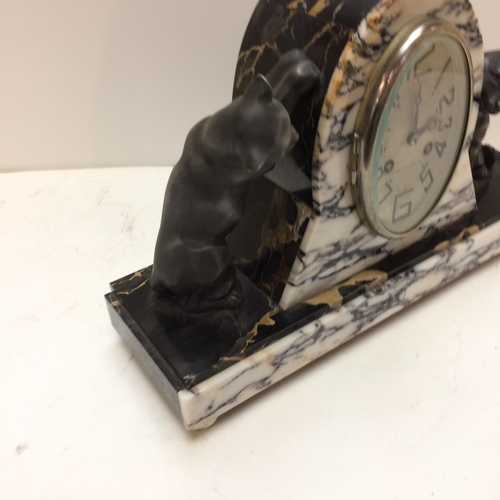 262 - A French slate and marble mantle clock, in the Art Deco taste, the oval dial marked 108-110 Rue Gamb... 