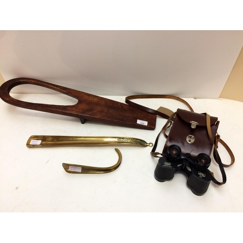 264 - A long brass shoe horn, and a short one, a mahogany boot jack, a pair of Vintage binoculars in case ... 