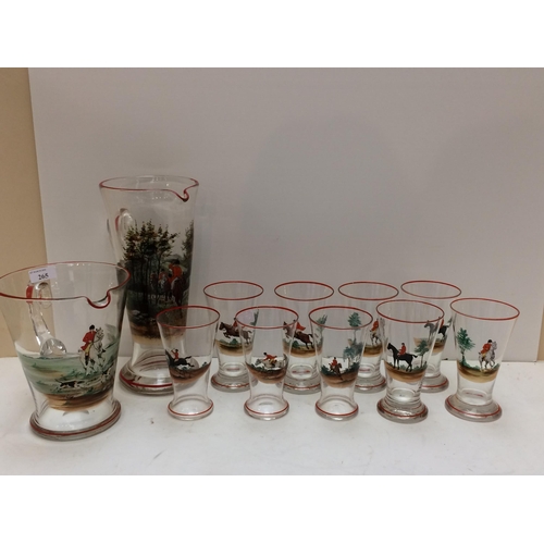 265 - A vintage, decorative hunting themed glass set comprising a tall lemonade jug, a wide Pimm's jug and... 