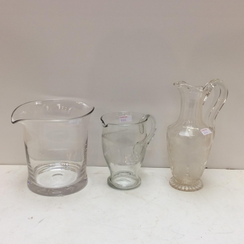 266 - a large heavy glass ice bucket/wine bucket, a tall etched glass jug, and a smaller one