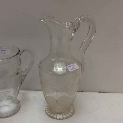 266 - a large heavy glass ice bucket/wine bucket, a tall etched glass jug, and a smaller one