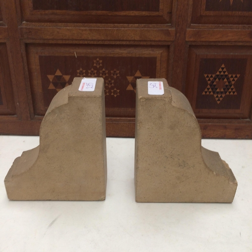 275 - Two wooden table lamps, and a pair of stone bookends, purporting to come from The houses of Parliame... 