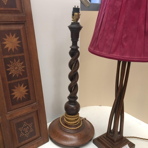 275 - Two wooden table lamps, and a pair of stone bookends, purporting to come from The houses of Parliame... 